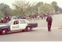 Ptl. Burkenhead with Car #4 on Summer Street traffic control point for a parade (1983)