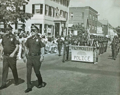 Chief Richard Nagle and Capt. William Murphy lead police formation in parade (circa 1978)