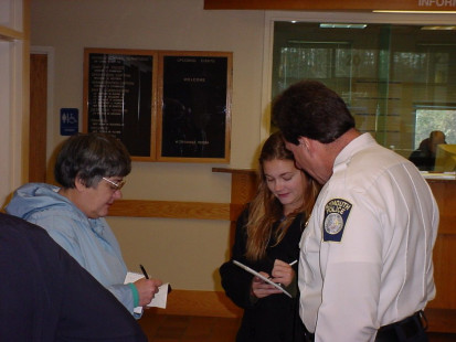 Retiring Lt. Ahlquist interviewed by press on last day of service (14/Nov/03)